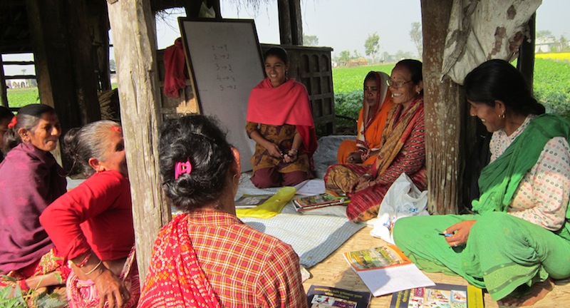 Group of Women Learning to Read