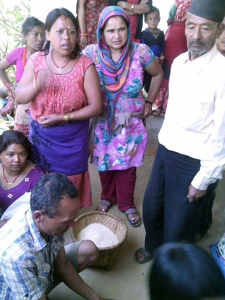 Community members donate rice