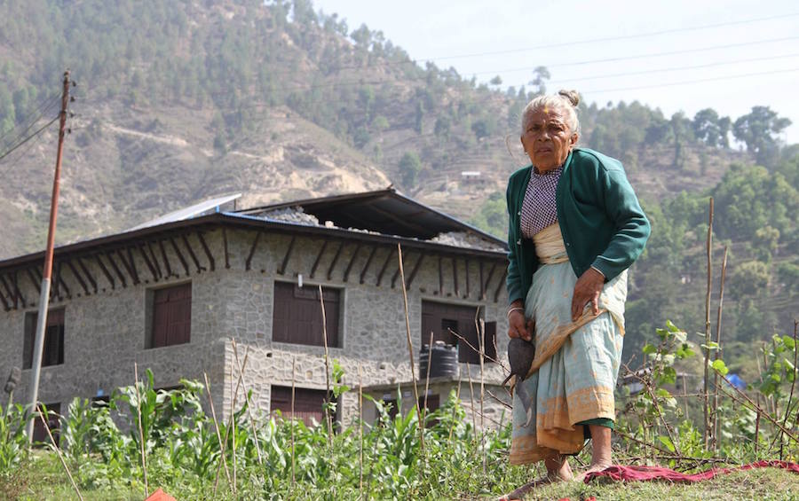Subhadra in front of damaged Nuwakot Center