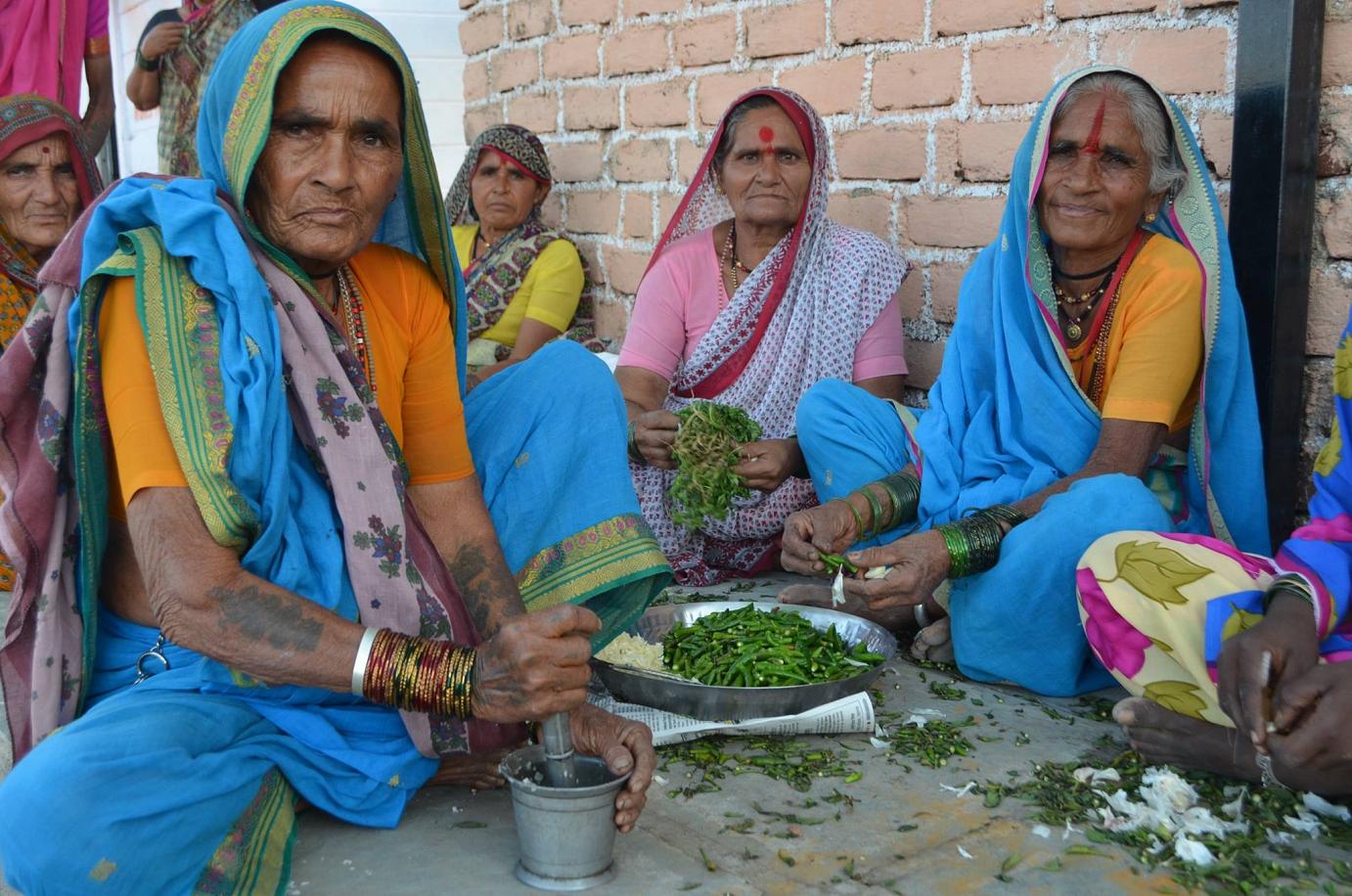 Women prepare dinner for the inauguration in India